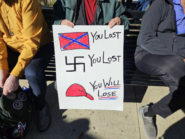 It has a Confederate flag
and the words 'you lost,' a Nazi swastika and the words 'you lost' and a MAGA hat and the words 'you will lose'