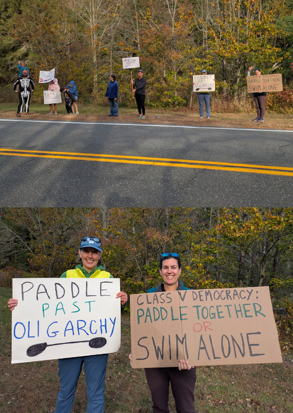 A small protest along a
very rural road lined with trees; among the signs are ones that say 'PADDLE PAST OLIGARCHY' and 'CLASS V DEMOCRACY:
PADDLE TOGETHER or SWIM ALONE.'