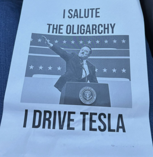 The flyer has a picture of Musk
doing the Nazi salute, and says: 'I SALUTE THE OLIGARCHY, I DRIVE TESLA'