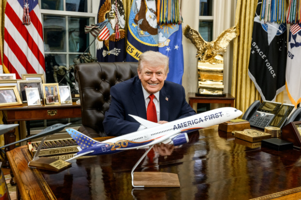 The model is about 3 feet long,
and the plane has 'AMERICA FIRST' in big letters, along with a stylized '250' on the tail