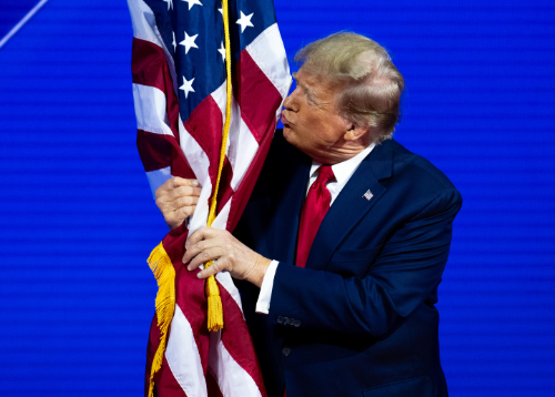 Trump hugging and kissing the American flag