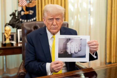 Trump holding a black
and white picture of a fist