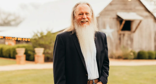 A 60-ish man, with a long, white beard