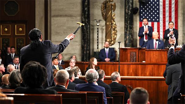 Rep. Al Green shaking his cane at Donald Trump