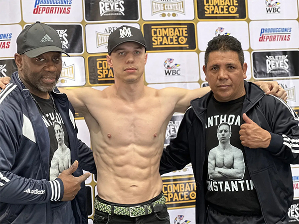 Anthony Constantino; he's participating in a UFC event, and is shirtless and muscular'