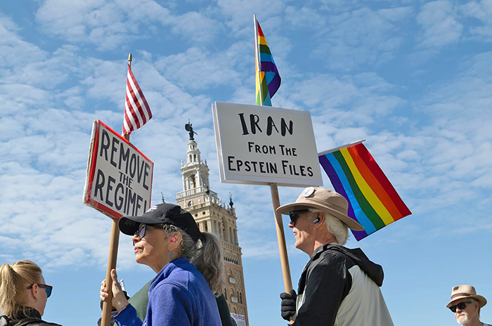 People in Philadelphia; they are carrying signs that say 'Remove the Regime'
and 'Iran from the Epstein Files' along with LGBTQ flags