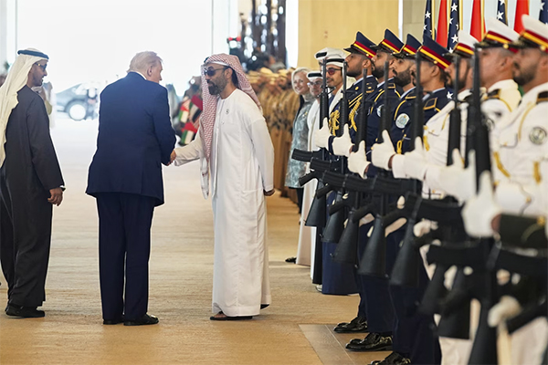 Trump in UAE shaking hands with Tahnoon