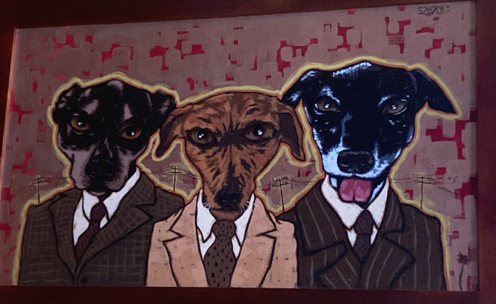 Three dogs, in suits, with angry looks on their faces