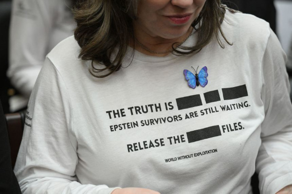 It says 'The Truth Is
[REDACTION] [REDACTION] [REDACTION]. Epstein survivors are still waiting. Release the [REDACTION] files. World without
exploitation.