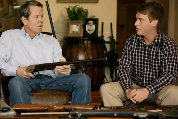 Gov. Brian Kemp (R-GA) posing with a gun