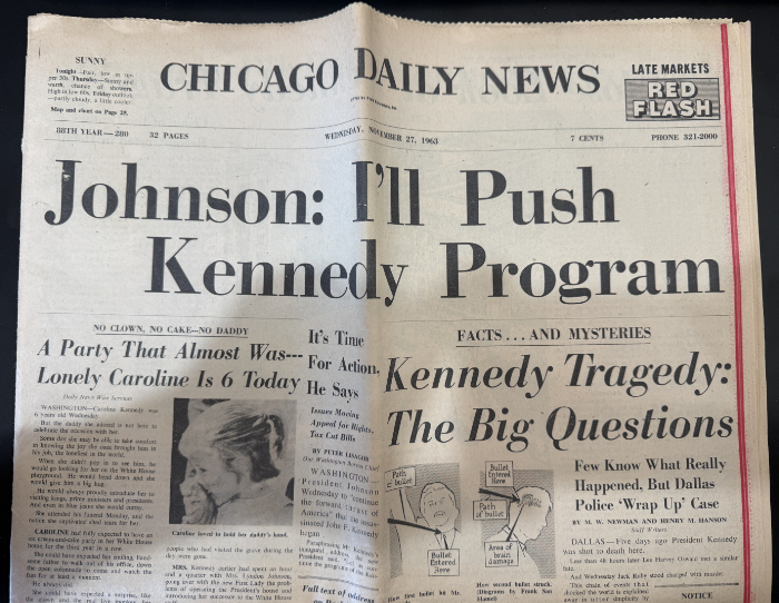 The front page of the paper
is exactly as described; the headline is in VERY big letters