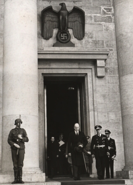 A picture of the Nazis' 
Reich Chancellery, with a Nazi eagle above the door, from 1938.