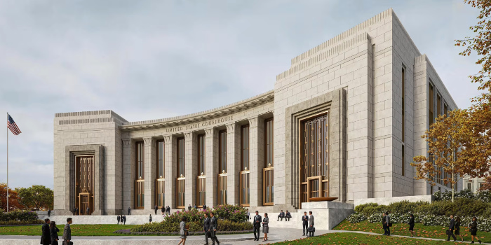 The building is white marble, and 
appears to be one large story tall. It has two large doorways at the ends, and seven tall windows between them. The doors and
windows have golden, art deco detailing. The building itself is slightly concave, such that the windows are set further
back than the doors. The overall presentation is intimidating