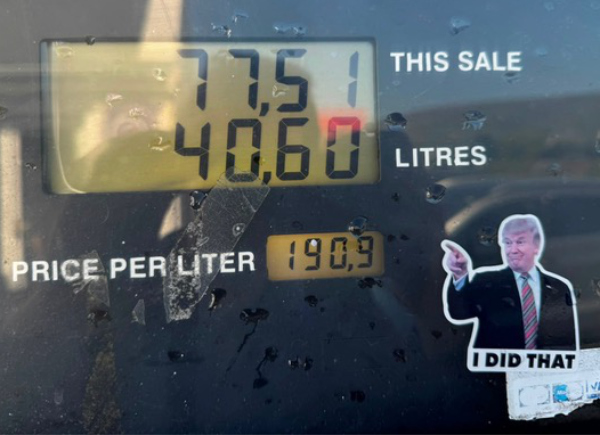 A Trump sticker with the 
tagline 'I DID THAT,' affixed to a gas pump.